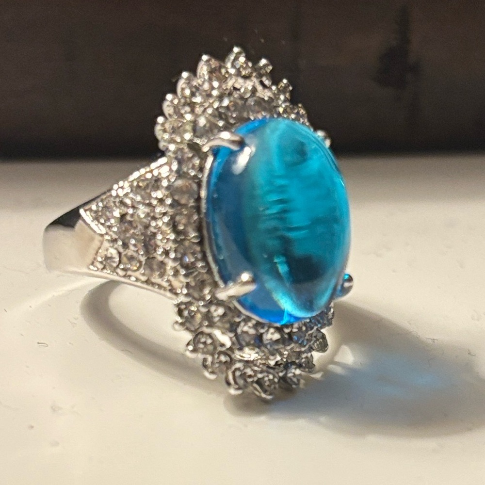 Silver Ring with Vivid Blue Oval Gem and Crystal Accents